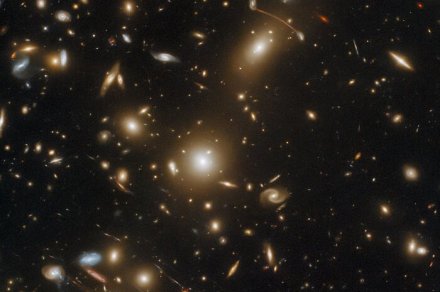 This galaxy cluster is so massive it warps space-time